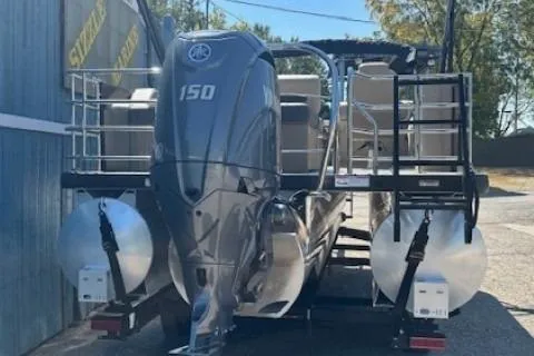 Slide: The Image of 2024 Godfrey SWEETWATER 2286 SFL pontoon boat with 150 HP engine, docked outdoors. - 9