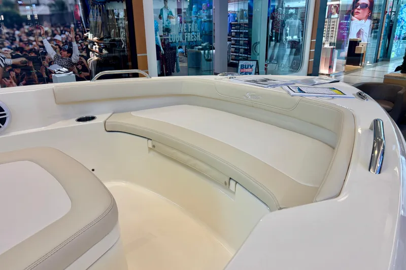 Slide: The Image of Interior of 2026 Scout 188 Sportfish boat with white seating and modern design. - 11