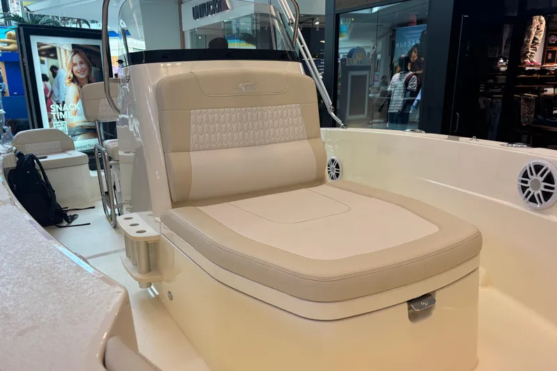 Slide: The Image of 2026 Scout 188 Sportfish boat interior with beige seating and modern design. - 8