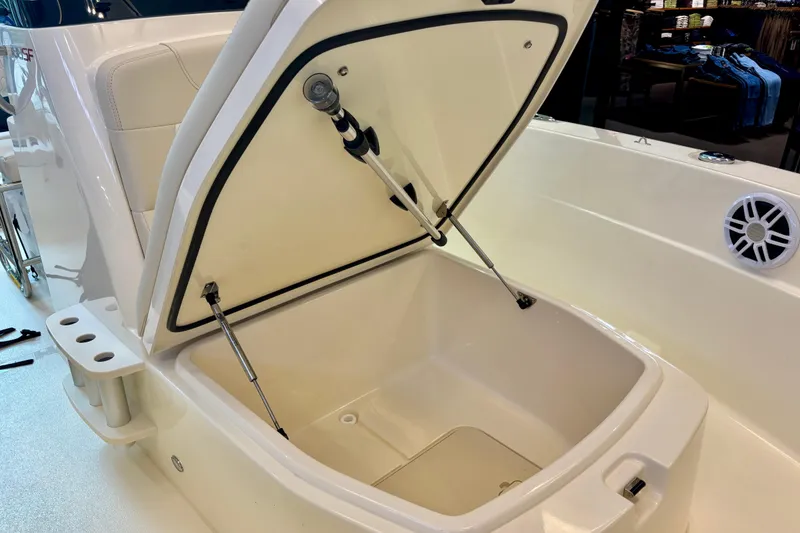 Slide: The Image of Open storage compartment on 2026 Scout 188 Sportfish boat, showcasing interior features. - 9