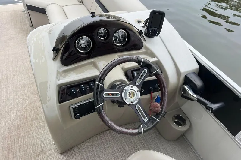 Slide: The Image of 2018 South Bay 224RS pontoon boat interior with spacious seating and modern dashboard. - 3