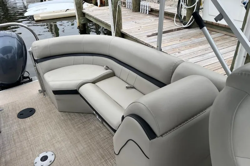 Slide: The Image of 2018 South Bay 224RS pontoon boat interior with plush seating and modern design. - 8