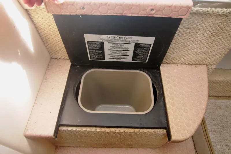 Slide: The Image of Built in Waste Bin under Steps - 56