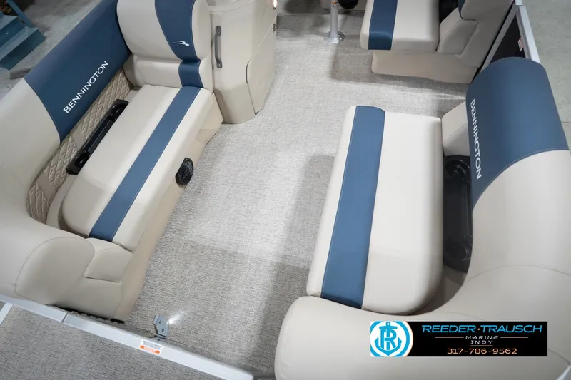 Slide: The Image of 2026 Bennington 168 SLJ pontoon boat in showroom with canopy and sleek design. - 12