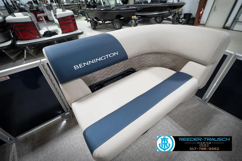 Slide: The Image of Interior of 2026 Bennington 168 SLJ pontoon boat with beige and blue seating. - 22