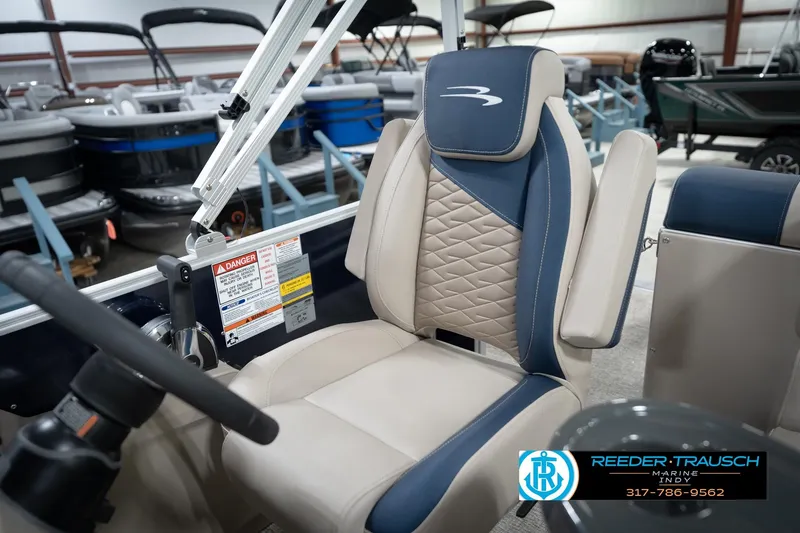 Slide: The Image of 2026 Bennington 168 SLJ boat interior with beige and blue seating. - 26