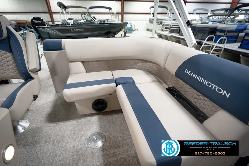 Slide: The Image of 2026 Bennington 168 SLJ pontoon boat interior with plush seating and table. - 29