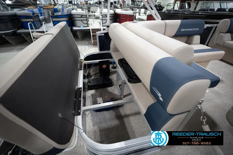 Slide: The Image of 2026 Bennington 168 SLJ pontoon boat interior with beige and blue seating at Reeder-Trausch Marine. - 33