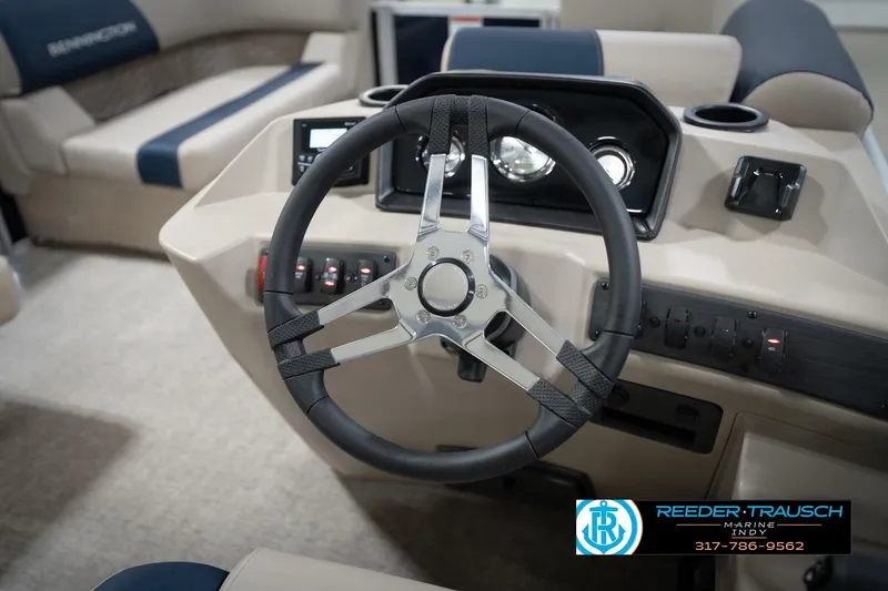 Slide: The Image of 2026 Bennington 168 SLJ pontoon boat interior with storage compartment open in showroom. - 34