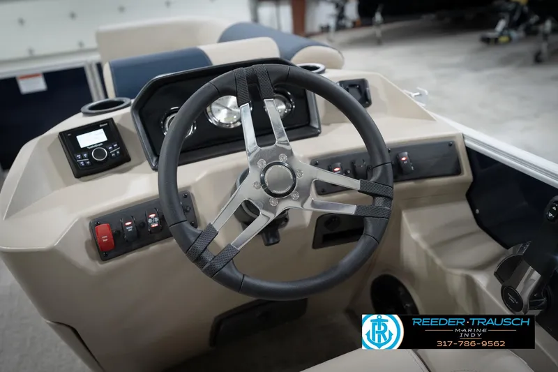 Slide: The Image of Steering wheel of a 2026 Bennington 168 SLJ boat, featuring modern controls and dashboard. - 35