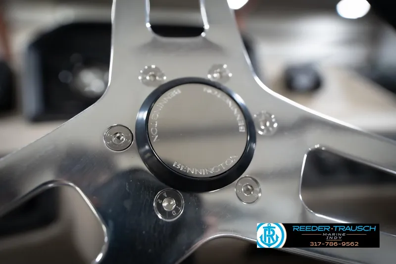 Slide: The Image of 2026 Bennington 168 SLJ boat dashboard with steering wheel and control panel. - 36