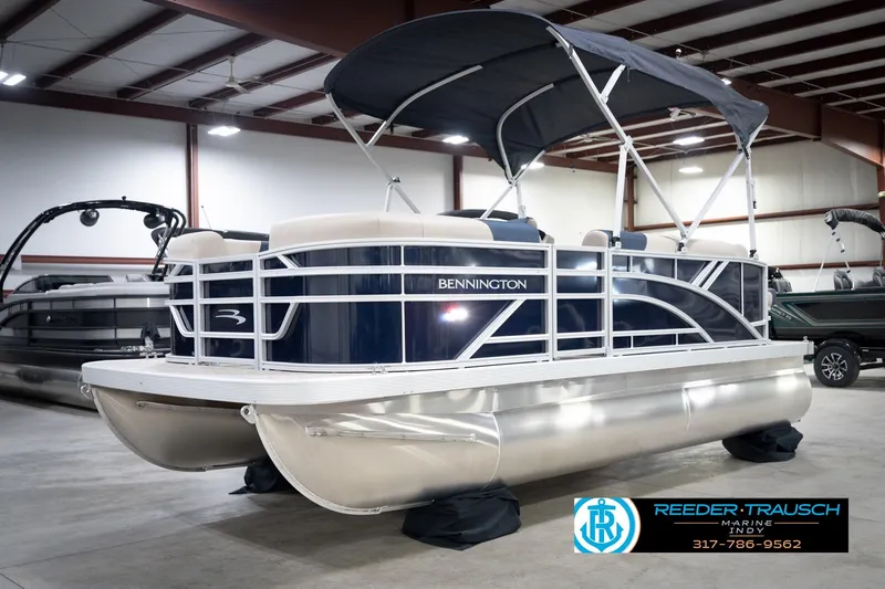 Slide: The Image of 2026 Bennington 168 SLJ pontoon boat in showroom, featuring sleek design and modern amenities. - 4