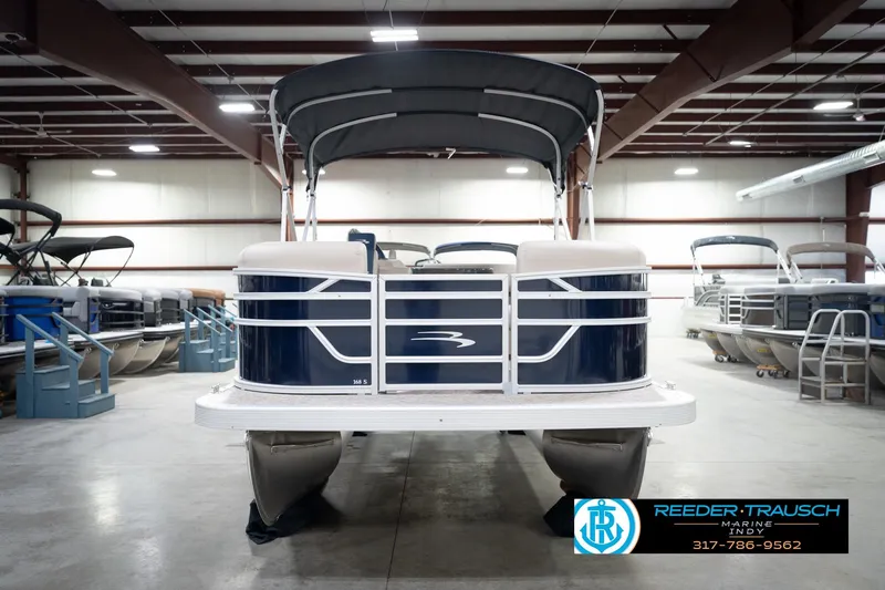 Slide: The Image of 2026 Bennington 168 SLJ pontoon boat with canopy in showroom. - 5