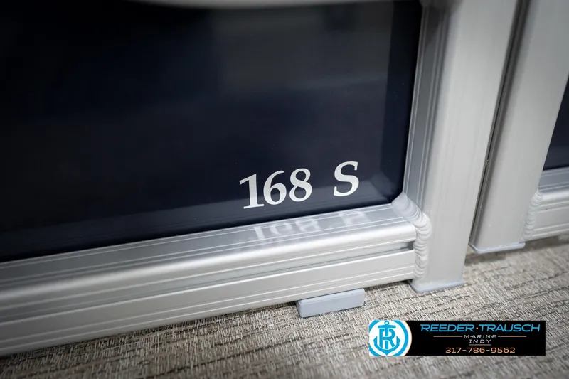 Slide: The Image of 2026 Bennington 168 SLJ boat with logo, featuring sleek design and Reeder-Trausch Marine contact details. - 55