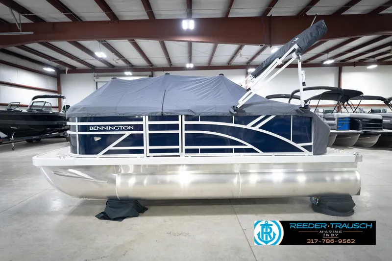 Slide: The Image of 2026 Bennington 168 SLJ boat detail with Reeder-Trausch Marine logo and contact number. - 56