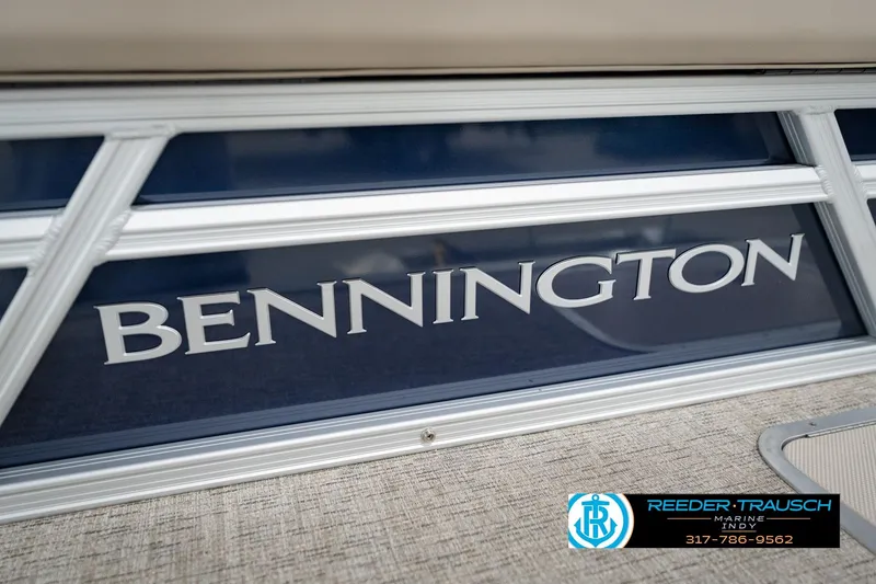 Slide: The Image of 2026 Bennington 168 SLJ boat with logo, featuring sleek design and Reeder-Trausch Marine contact details. - 61