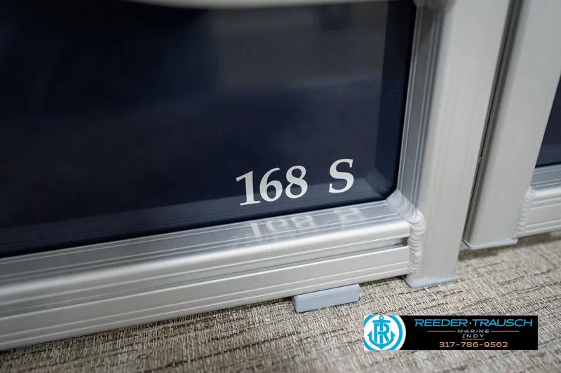 Slide: The Image of 2026 Bennington 168 SLJ boat detail with Reeder-Trausch Marine logo and contact number. - 62