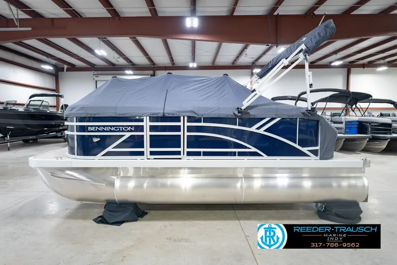 Slide: The Image of 2026 Bennington 168 SLJ pontoon boat with cover in showroom. - 63