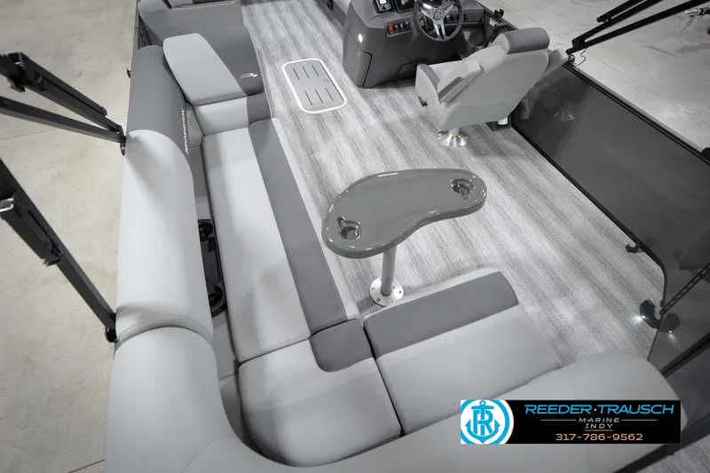 Slide: The Image of Interior of 2026 Bennington 21 SL pontoon boat with gray seating and steering console. - 15