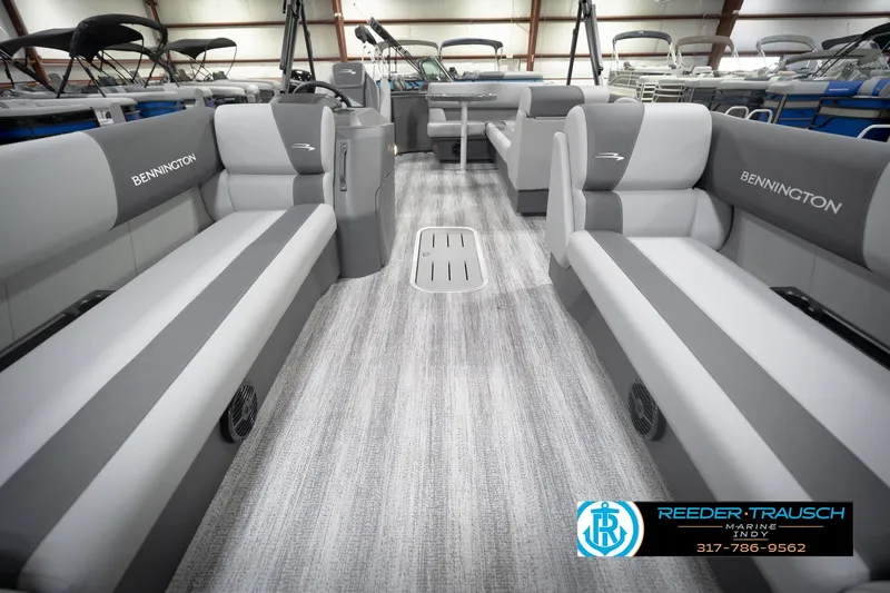 Slide: The Image of 2026 Bennington 21 SL pontoon boat interior with gray seating and modern design. - 16