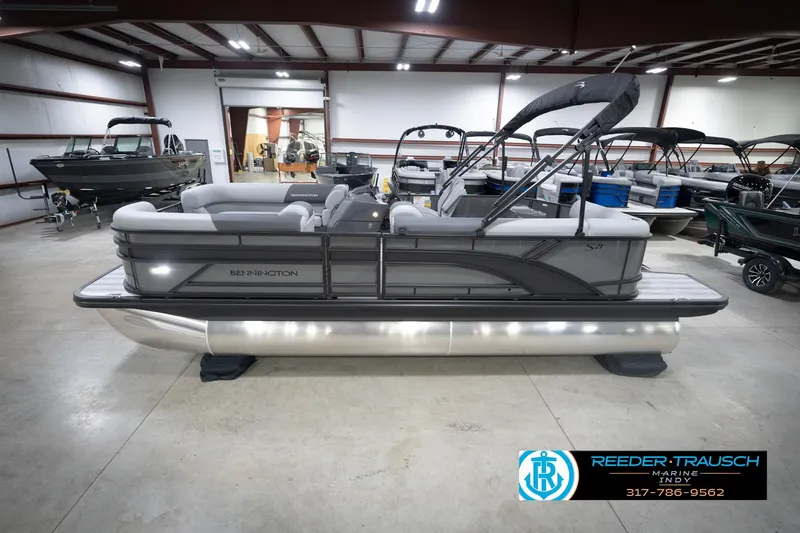 The Image of 2026 Bennington 21 SL pontoon boat in showroom, side view. - 2