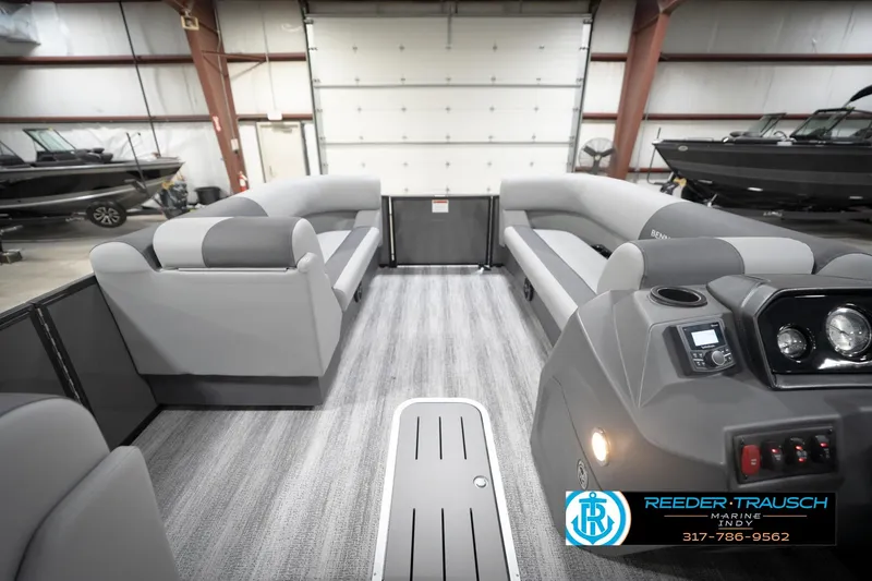 Slide: The Image of Interior of 2026 Bennington 21 SL pontoon boat with modern seating and control panel. - 20