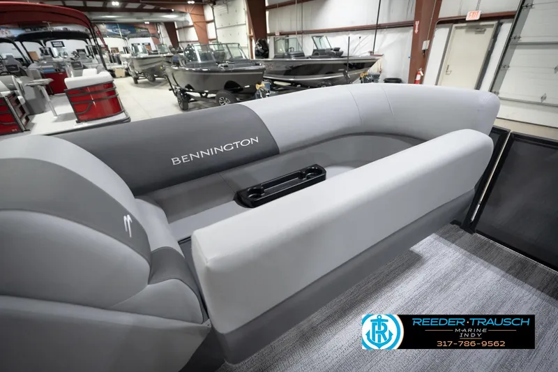 Slide: The Image of 2026 Bennington 21 SL pontoon boat interior at Reeder-Trausch Marine showroom. - 23