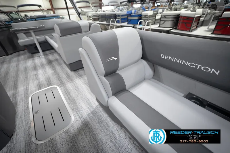 Slide: The Image of 2026 Bennington 21 SL boat interior with gray seating and modern design. - 24