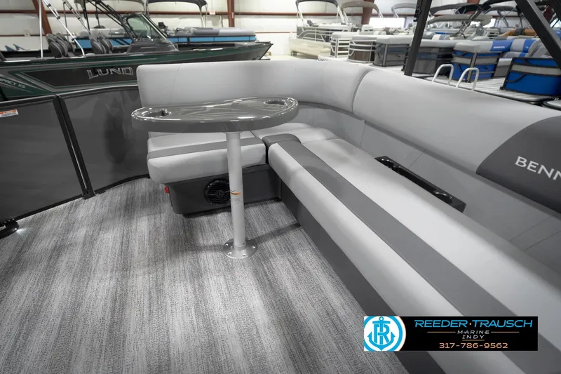 Slide: The Image of 2026 Bennington 21 SL pontoon boat interior with gray seating and table. - 30
