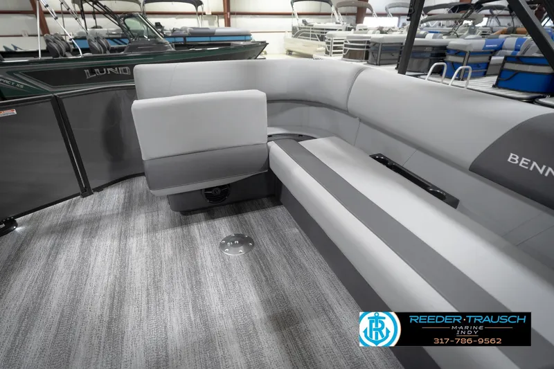 Slide: The Image of 2026 Bennington 21 SL pontoon boat interior with gray seating and carpeted flooring. - 32