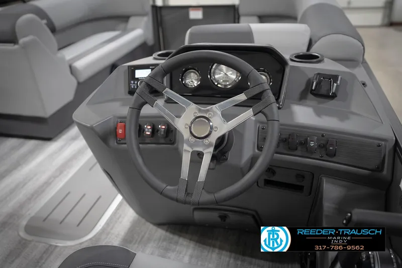 Slide: The Image of 2026 Bennington 21 SL boat dashboard with steering wheel and controls. - 34