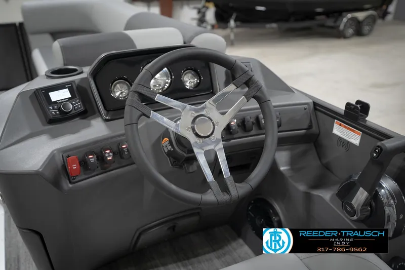 Slide: The Image of 2026 Bennington 21 SL boat dashboard with steering wheel and control panel. - 35