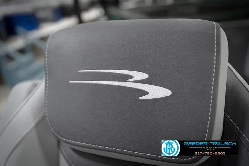 Slide: The Image of 2026 Bennington 21 SL boat seat with logo, featuring gray upholstery and white stitching. - 44