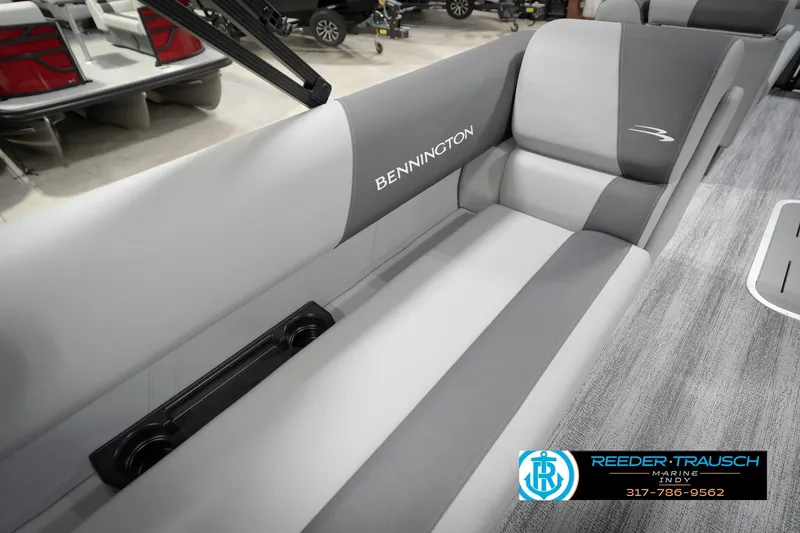 Slide: The Image of 2026 Bennington 21 SL boat interior with gray seating and logo. - 46