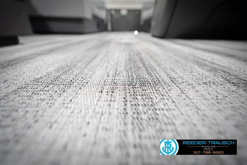Slide: The Image of Carpeted floor of a 2026 Bennington 21 SL boat, close-up view. - 50