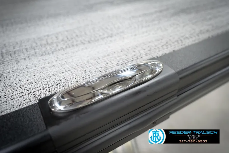 Slide: The Image of 2026 Bennington 21 SL boat detail with Reeder-Trausch Marine logo and contact information. - 58