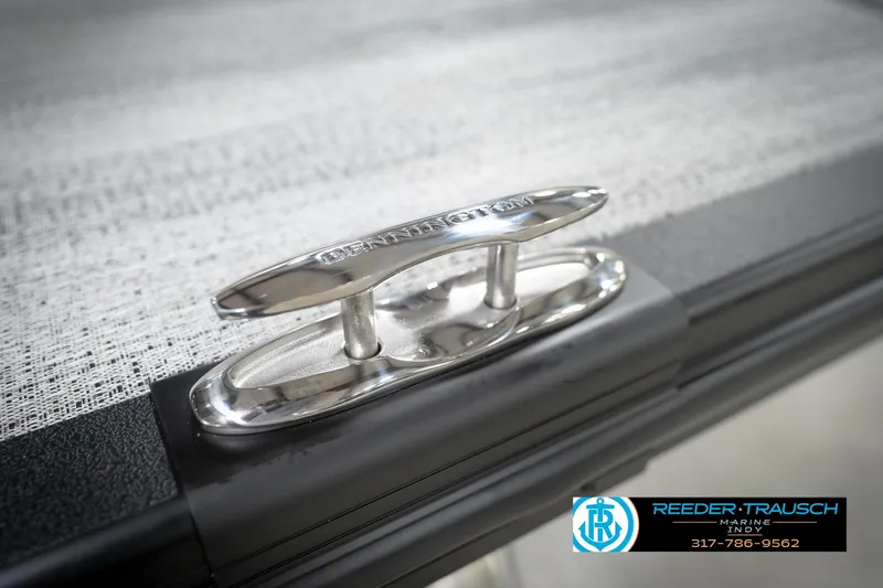 Slide: The Image of Close-up of a 2026 Bennington 21 SL boat cleat with Reeder-Trausch Marine logo. - 59