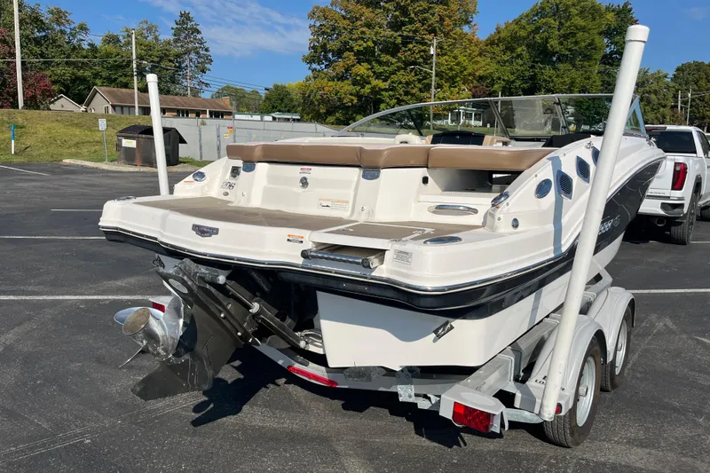 Slide: The Image of 2013 Chaparral 206 SSi boat on trailer in parking lot, rear view. - 5