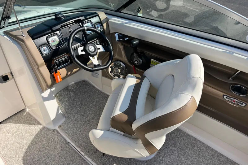 Slide: The Image of 2013 Chaparral 206 SSi boat interior with steering wheel and captain's seat. - 8