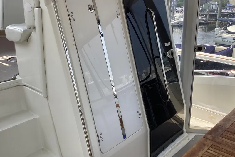 Slide: The Image of 2005 Carver 41 Cockpit Motor Yacht interior with sleek design and marina view. - 12