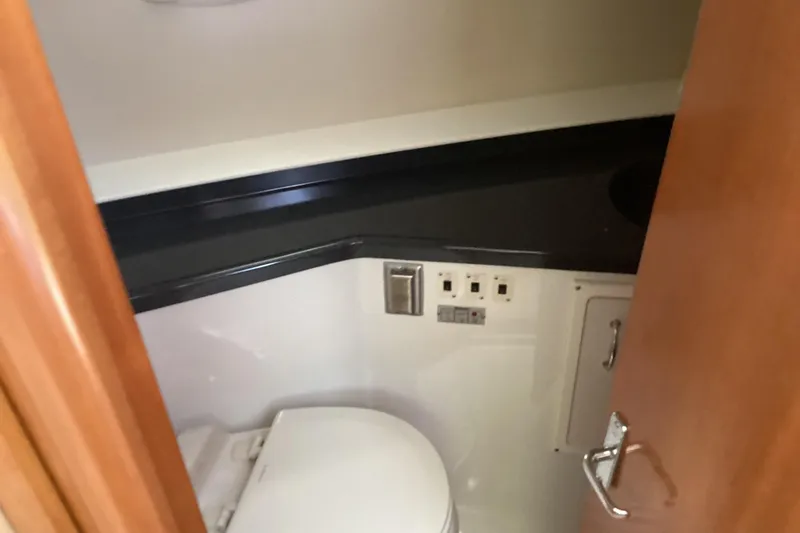 Slide: The Image of Bathroom interior of 2005 Carver 41 Cockpit Motor Yacht, featuring modern fixtures. - 17