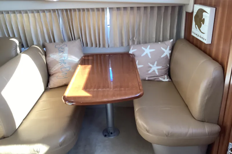 Slide: The Image of Interior of 2005 Carver 41 Cockpit Motor Yacht with cozy seating and decorative pillows. - 36