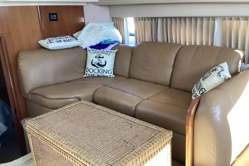 Slide: The Image of Interior of 2005 Carver 41 Cockpit Motor Yacht with leather sofa and nautical pillows. - 37