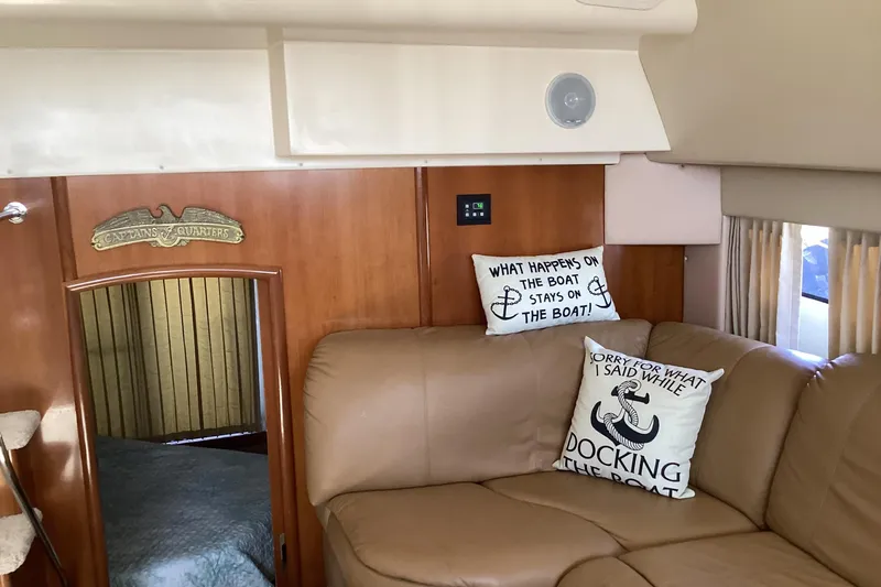 Slide: The Image of Interior of 2005 Carver 41 Cockpit Motor Yacht with humorous nautical pillows. - 41
