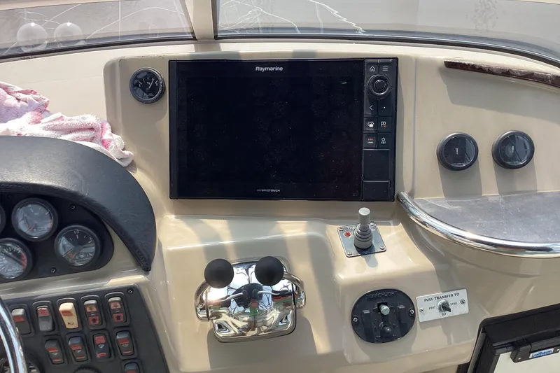 Slide: The Image of Control panel of a 2005 Carver 41 Cockpit Motor Yacht with navigation equipment. - 8