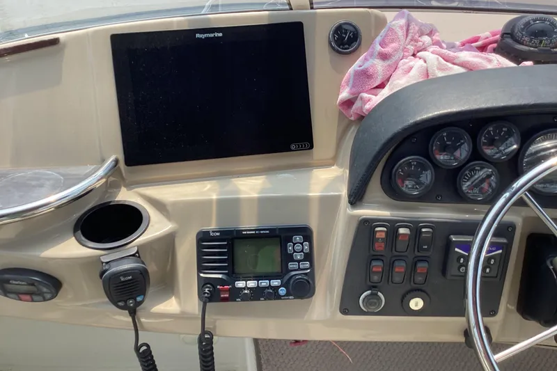Slide: The Image of 2005 Carver 41 Cockpit Motor Yacht dashboard with navigation and control instruments. - 9