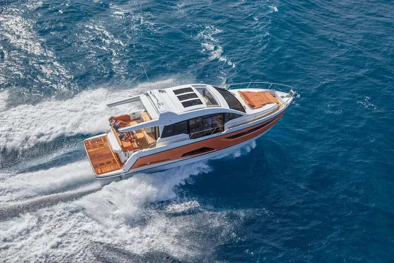 Slide: The Image of 2026 Sealine C430 yacht cruising on open blue sea, showcasing sleek design and luxury. - 2