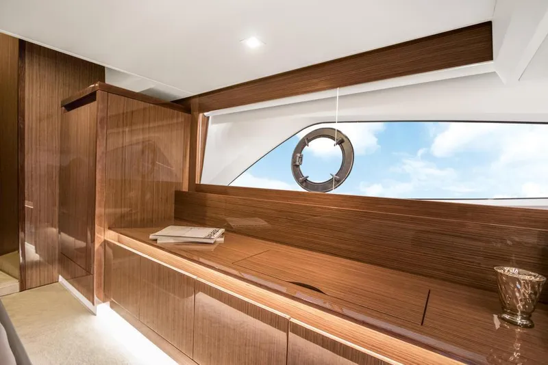 Slide: The Image of Luxurious interior of 2026 Sealine C430 yacht with sleek wood finish and ocean view. - 24