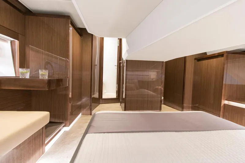 Slide: The Image of Luxurious interior of 2026 Sealine C430 yacht, featuring elegant wood finishes and modern design. - 26