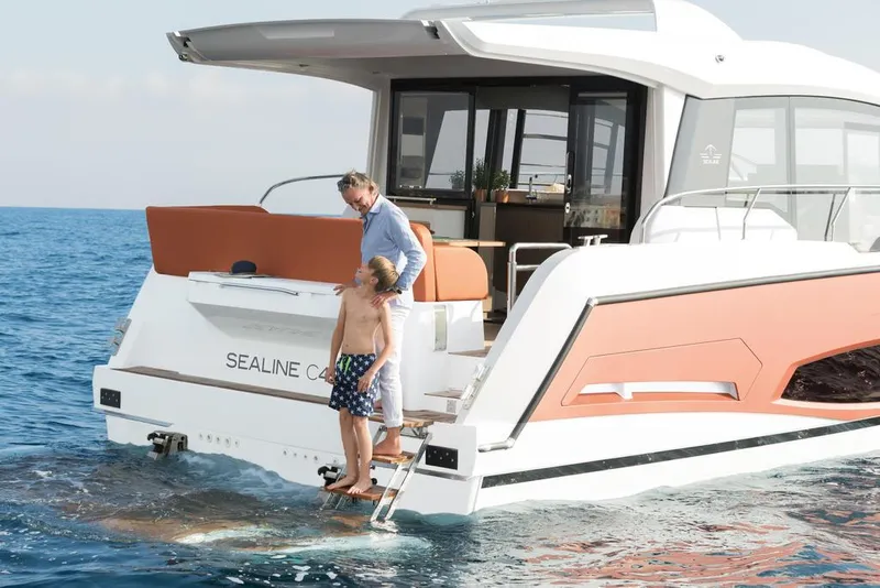 Slide: The Image of Father and son on 2026 Sealine C430 yacht, enjoying the ocean view. - 5